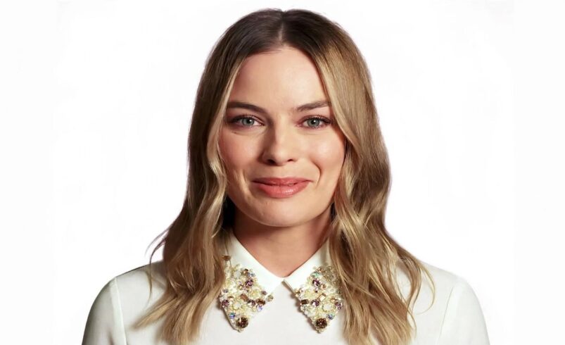 Margot Robbie fashion premiere portrait 2016 Oxfam I Hear You project white jewelled collar shirt